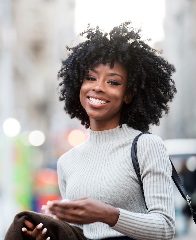 Happy woman in a gray sweater