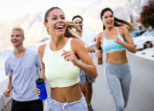 Group of friends running after EMSCULPT treatments