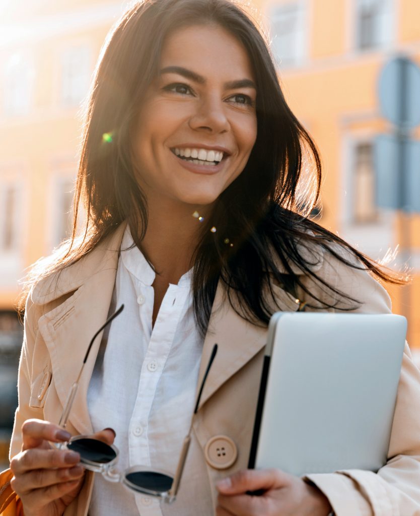 Business woman holding a laptop