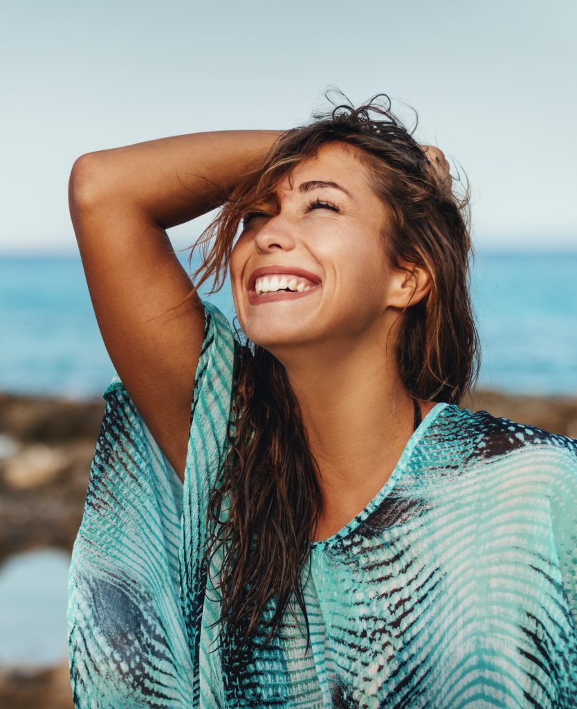 Happy woman at the beach